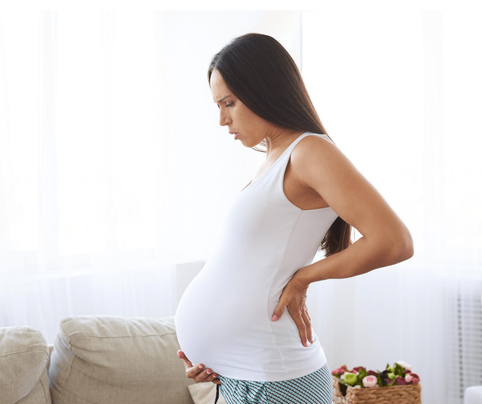 can lower back pain be a first sign of pregnancy